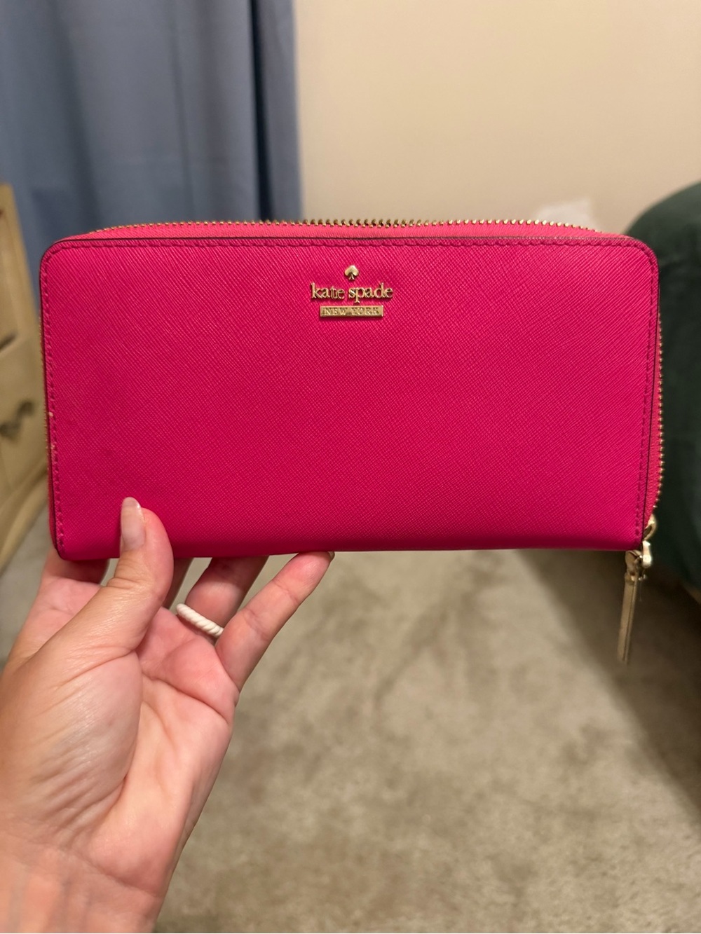 kate spade fuchsia zip-around saffiano wallet with gold logo